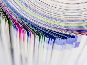 Stack of colorful coated paper of various colors